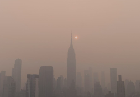 Canadian wildfire smoke causing a haze around New York City.