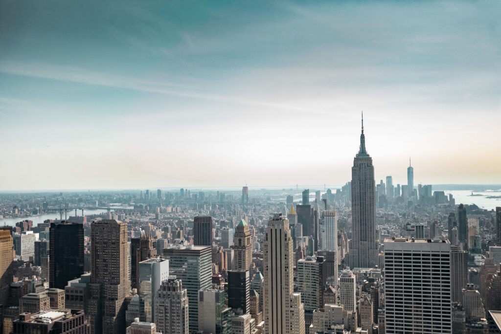 Skyline image of New York City with the Empire State Building prominent. Local Law 97 (LL97) fines are in effect now.