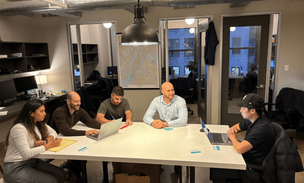 Asha, Joe, Greg, Rob, and Kevin in a meeting at the Parity office discussing Grid-Interactive Efficient Building (GEBs).