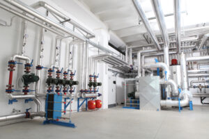 Central heating and cooling system control in a boiler room that PropTech solutions can automate.