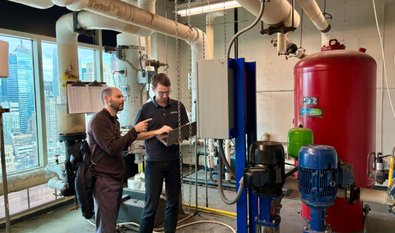 Joe and Stuart troubleshooting HVAC systems at a client's building.