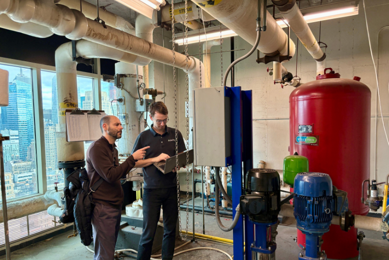 Joe and Stuart troubleshooting HVAC systems at a client's building.