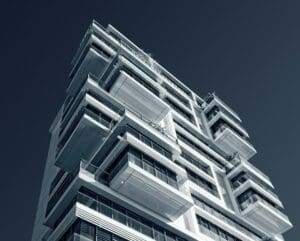 Highrise white condo building with balconies that is a good fit for Parity's services